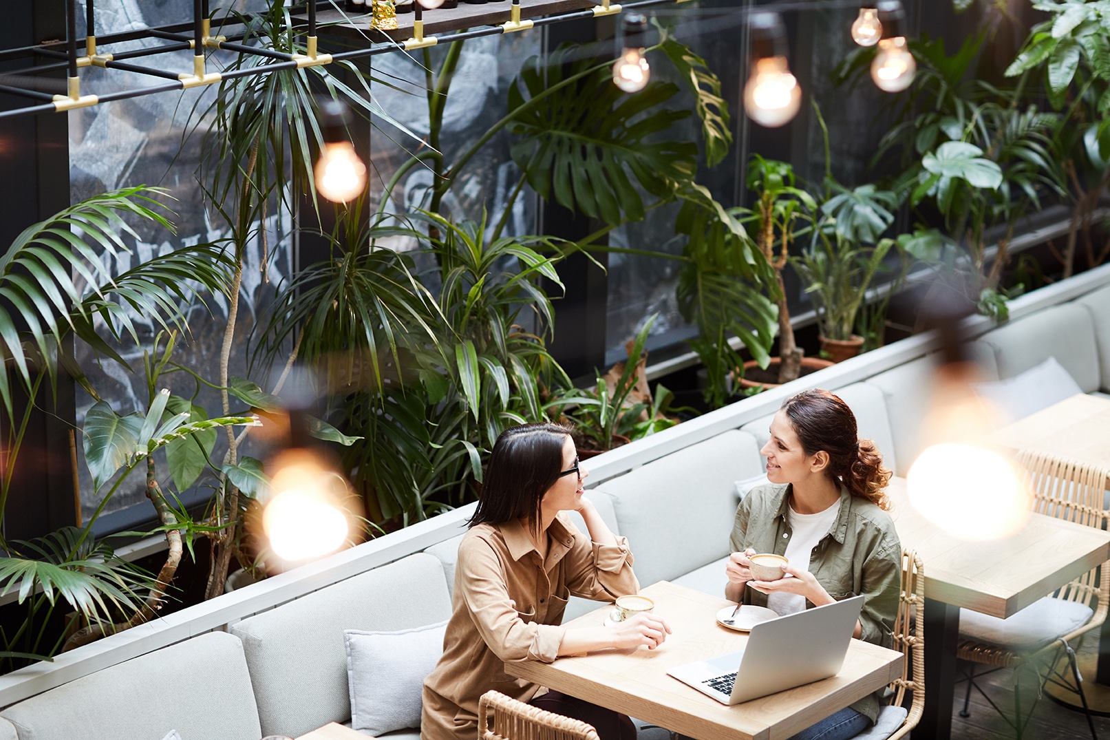 Above,View,Of,Content,Young,Lady,Entrepreneurs,Sitting,At,Table